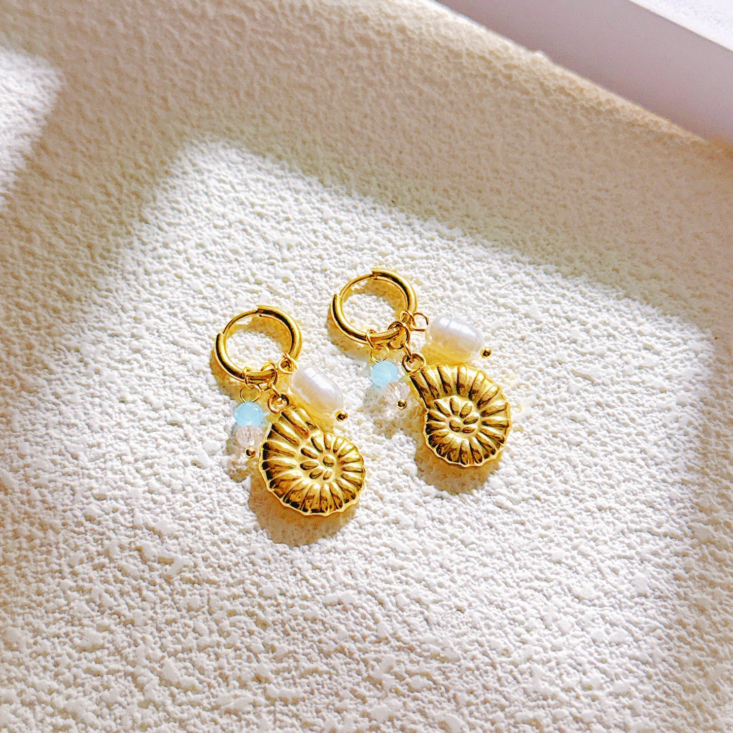 Boucle d’oreille pendante escargot marin acier inoxydable