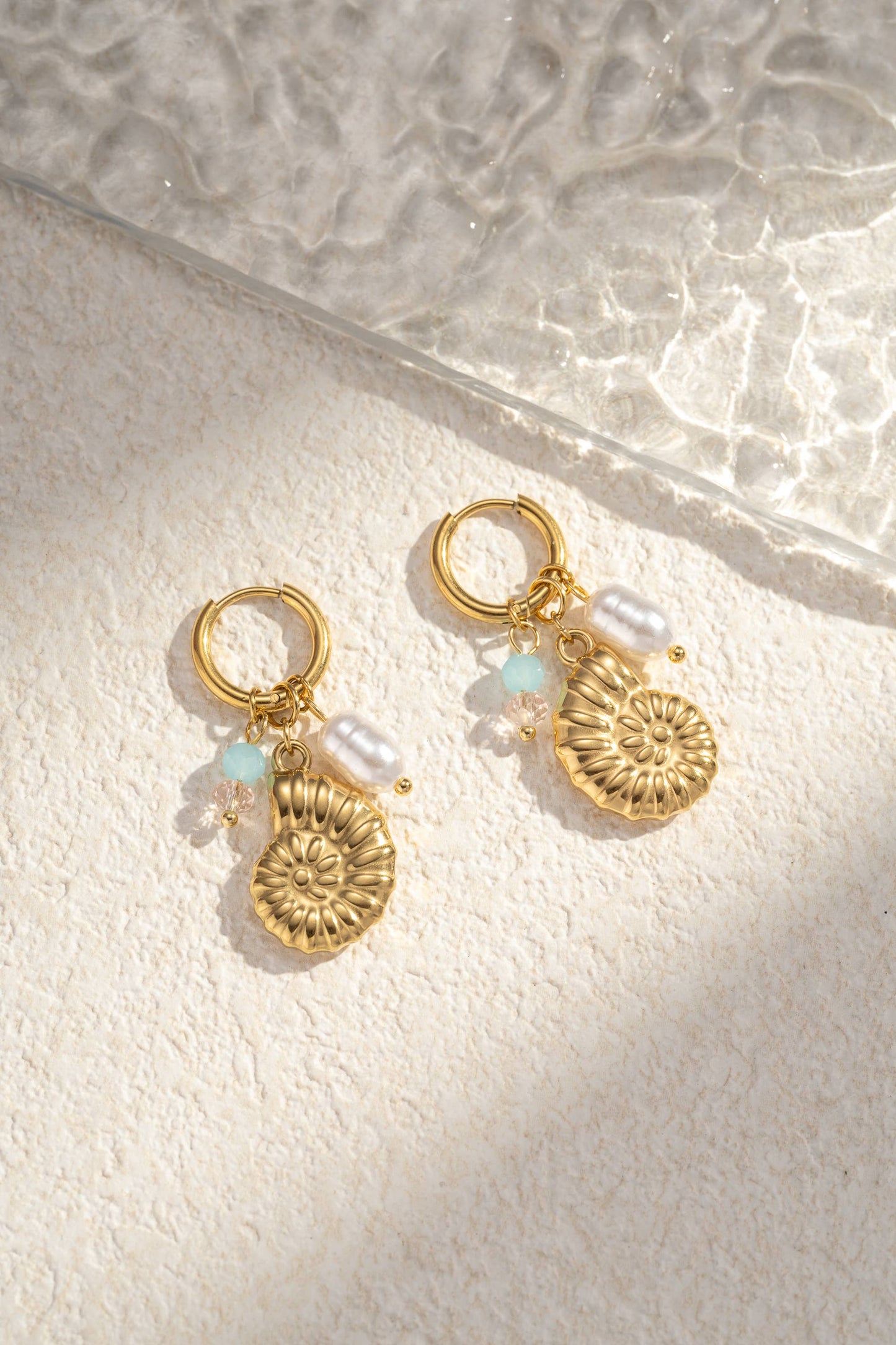 Boucle d’oreille pendante escargot marin acier inoxydable